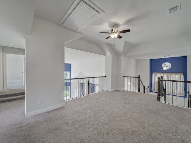 empty room with carpet, ceiling fan, and lofted ceiling