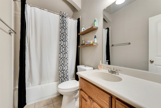 full bathroom featuring vanity, toilet, shower / bath combo with shower curtain, and tile patterned flooring