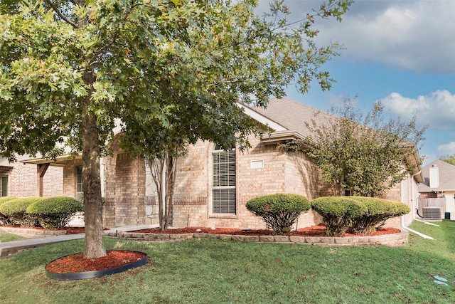 view of side of home with a lawn