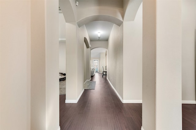 hallway with dark hardwood / wood-style floors