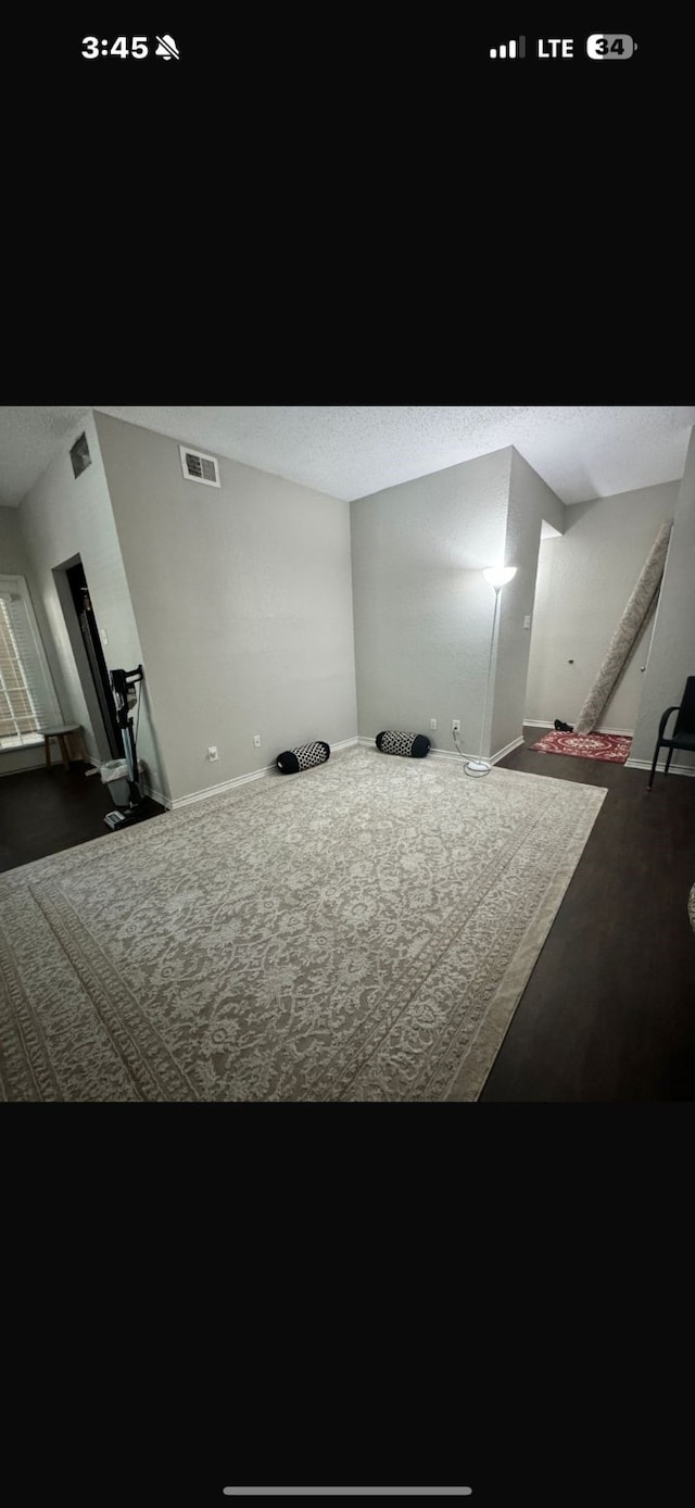 home theater room with a textured ceiling