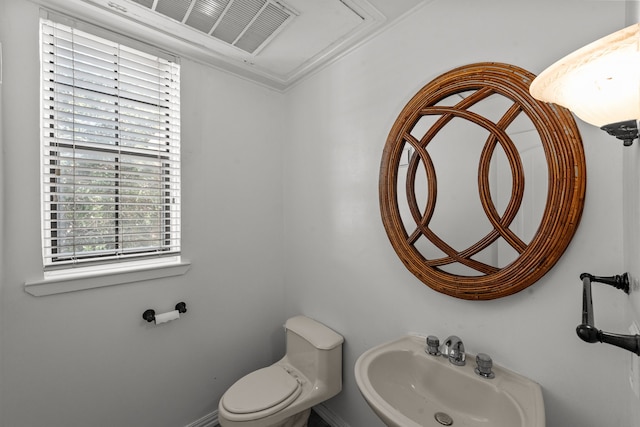 bathroom with toilet and sink