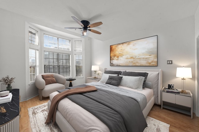 bedroom featuring ceiling fan and light wood-type flooring