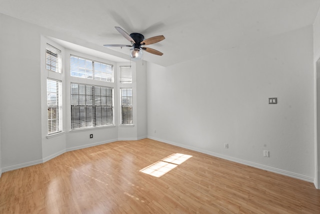 spare room with ceiling fan and light hardwood / wood-style flooring