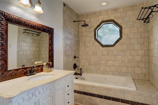 bathroom featuring vanity and tiled shower / bath