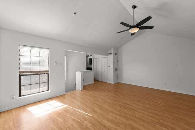 unfurnished living room with ceiling fan, light wood-type flooring, and lofted ceiling