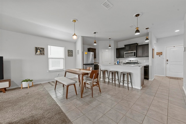 dining room with light tile patterned flooring