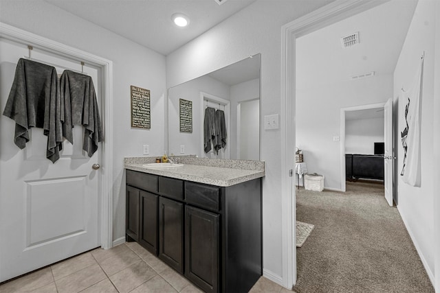 bathroom with vanity and tile patterned floors