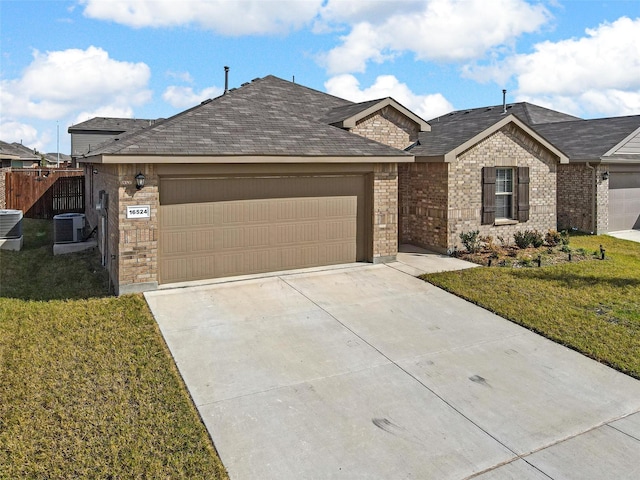 single story home with a garage, central air condition unit, and a front yard