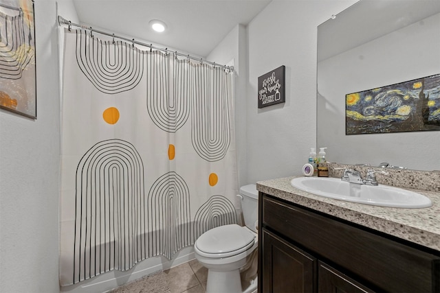 full bathroom featuring toilet, vanity, tile patterned floors, and shower / tub combo with curtain