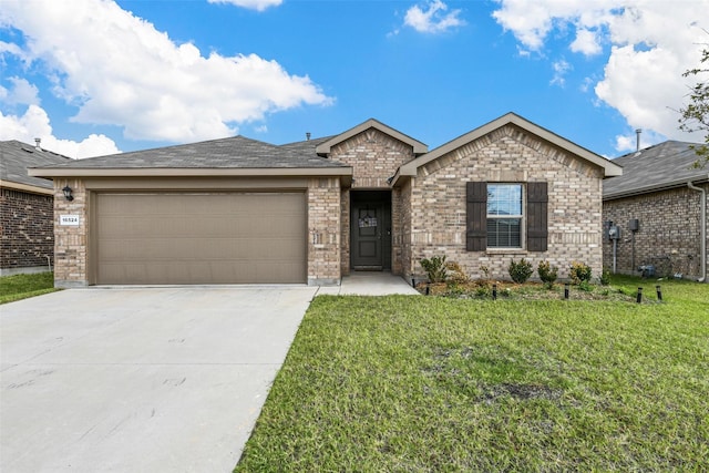 ranch-style house featuring a garage and a front yard