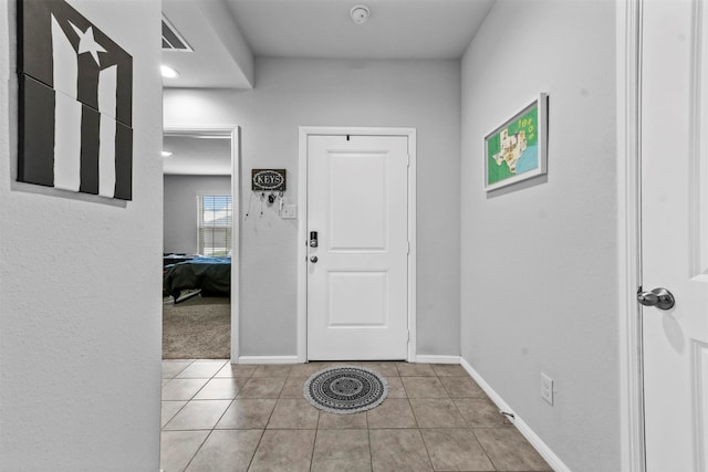 entrance foyer with light tile patterned floors