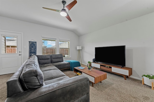 living room with carpet floors, a wealth of natural light, and vaulted ceiling