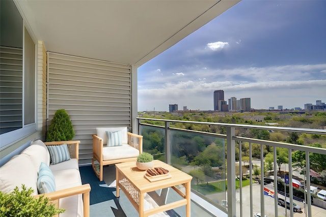 balcony with a view of city and outdoor lounge area