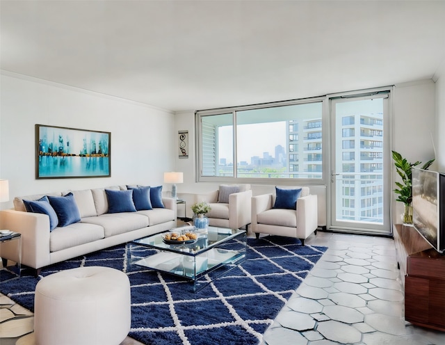 living area featuring tile patterned floors and crown molding