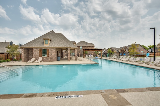 view of swimming pool with a patio area