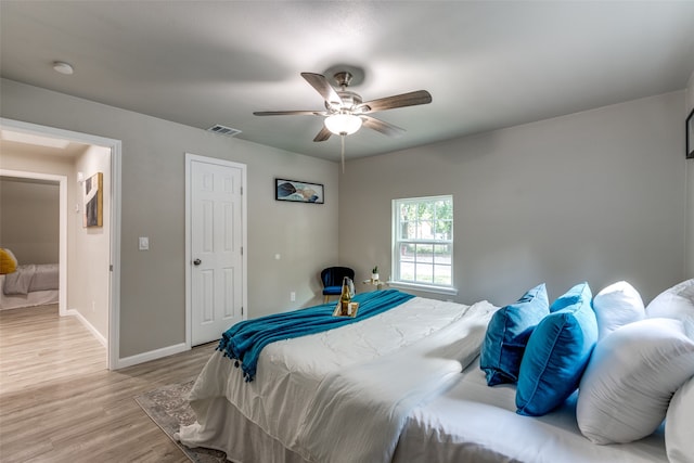 bedroom featuring light hardwood / wood-style flooring and ceiling fan