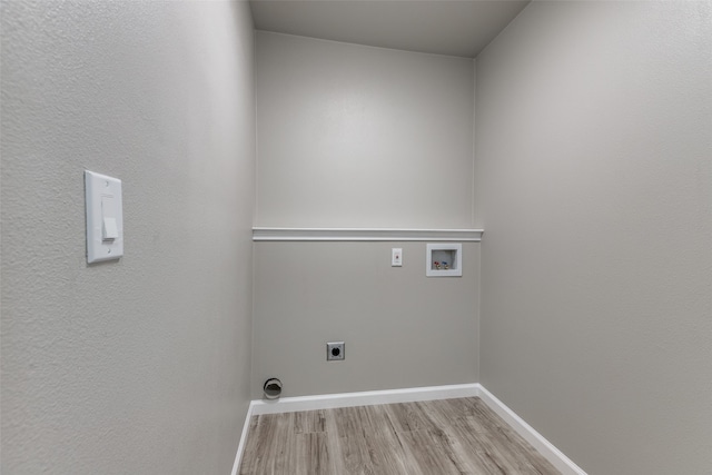 laundry room featuring hookup for an electric dryer, washer hookup, and light hardwood / wood-style floors