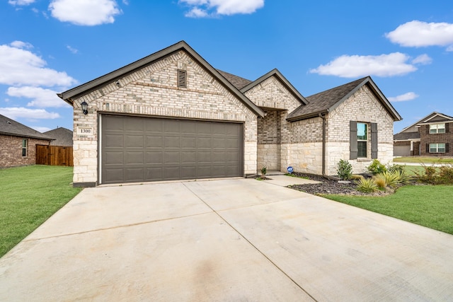 view of front of house featuring a front yard and a garage