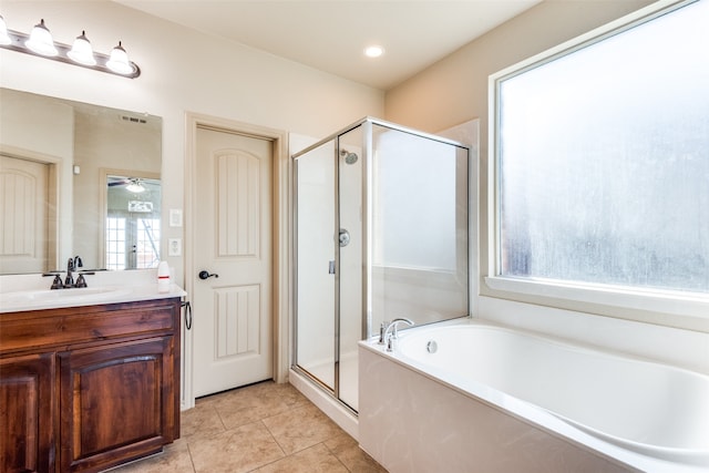 bathroom featuring vanity, independent shower and bath, tile patterned flooring, and ceiling fan