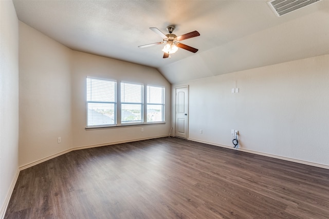 unfurnished room featuring dark wood-type flooring, ceiling fan, and lofted ceiling