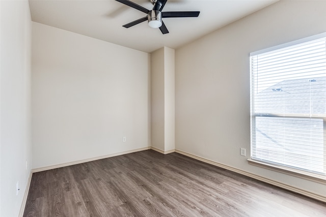 unfurnished room with a healthy amount of sunlight, hardwood / wood-style flooring, and ceiling fan