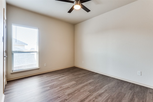 empty room with hardwood / wood-style flooring and ceiling fan