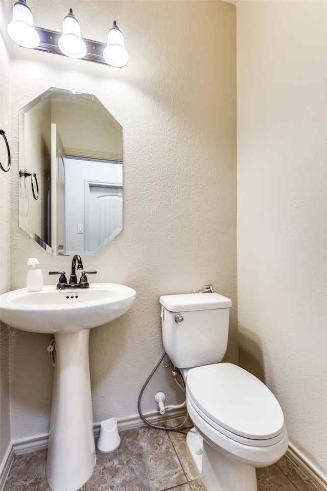 bathroom featuring toilet