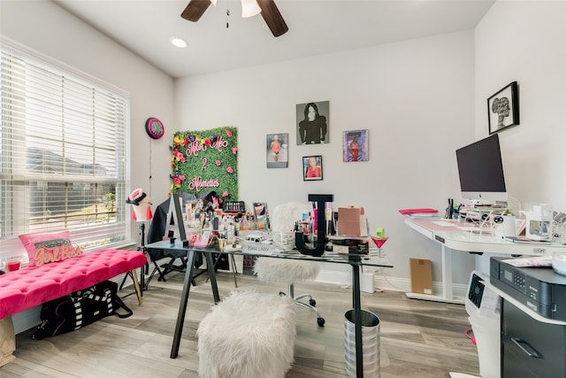 office space with ceiling fan and light hardwood / wood-style floors