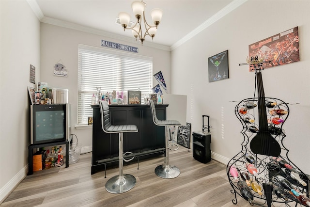 miscellaneous room featuring a notable chandelier, crown molding, and light wood-type flooring