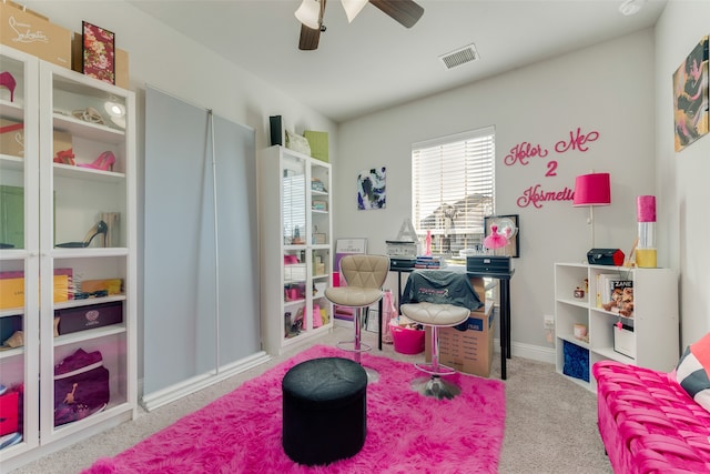 recreation room featuring ceiling fan and light colored carpet