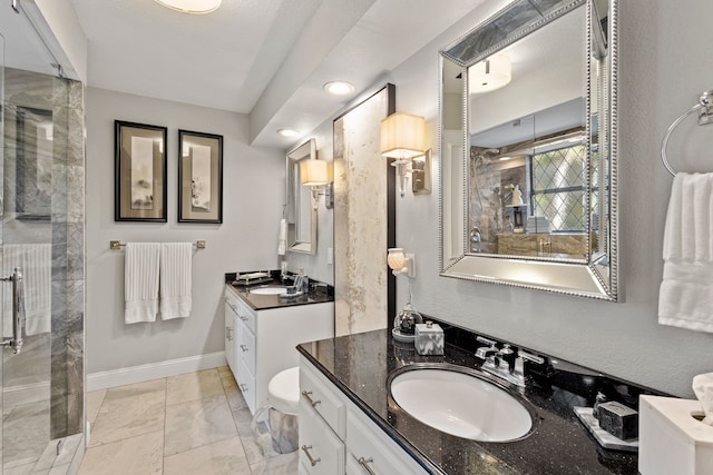 bathroom featuring vanity and a shower with door