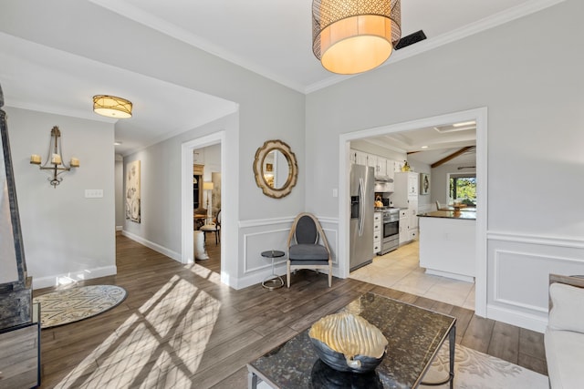 interior space featuring light hardwood / wood-style flooring and crown molding