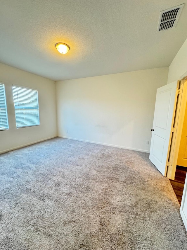 720 Juniper St, Anna, TX 75409 - carpeted spare room with a textured ceiling and baseboards