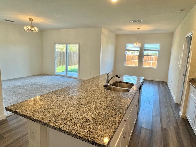 720 Juniper St, Anna, TX 75409 - kitchen featuring a sink, white cabinetry, a chandelier, and baseboards