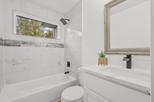 full bathroom with vanity, toilet, and tiled shower / bath combo