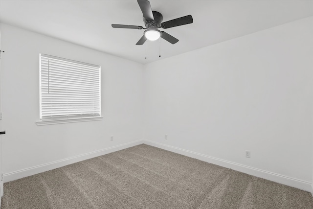 empty room featuring carpet and ceiling fan