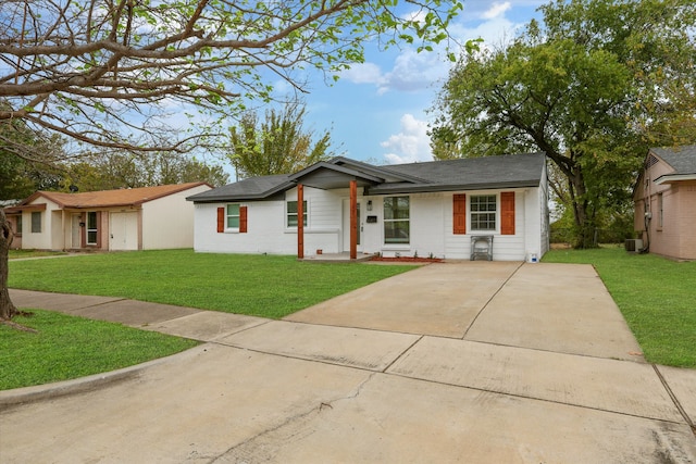 ranch-style home with central AC and a front lawn