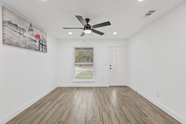 unfurnished room featuring ceiling fan and light hardwood / wood-style flooring