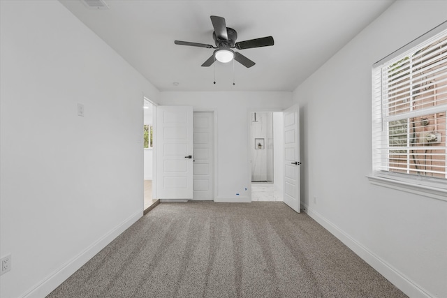 unfurnished room featuring carpet flooring and ceiling fan