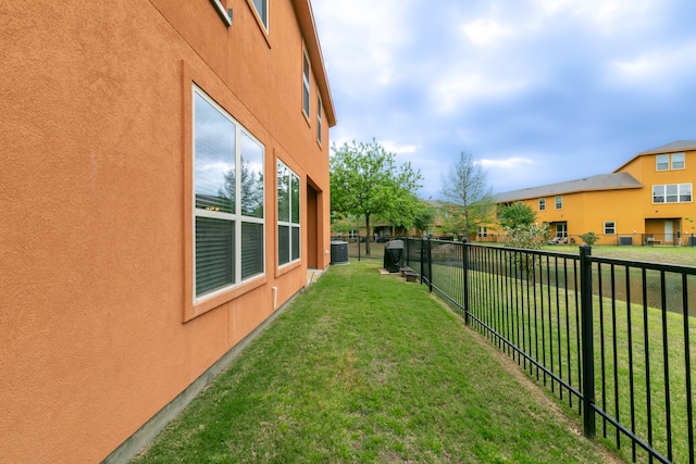 view of yard with central AC unit