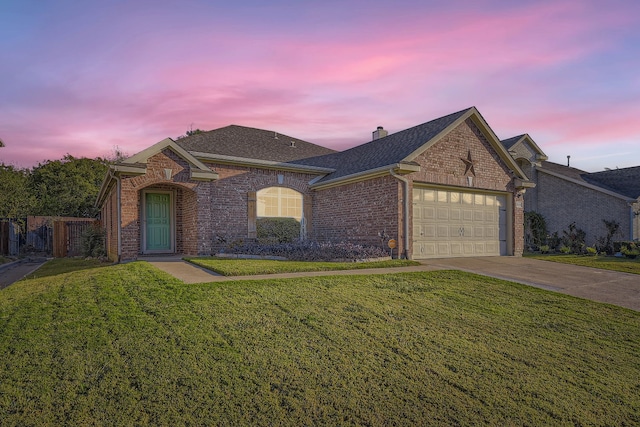 view of front of home featuring a yard and a garage