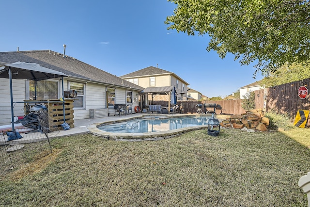 view of pool featuring a yard and a patio area