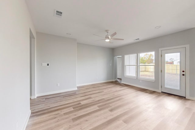 unfurnished room featuring ceiling fan and light wood-type flooring