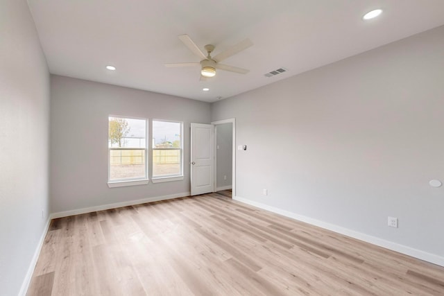 empty room with light hardwood / wood-style floors and ceiling fan