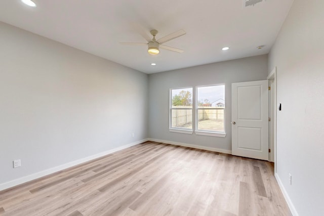 empty room with light hardwood / wood-style flooring and ceiling fan