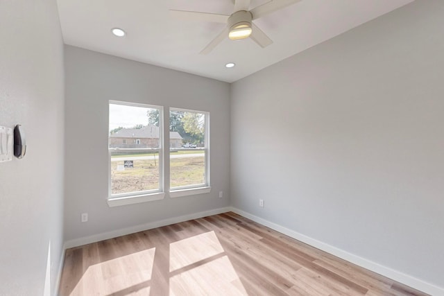 unfurnished room with light wood-type flooring and ceiling fan