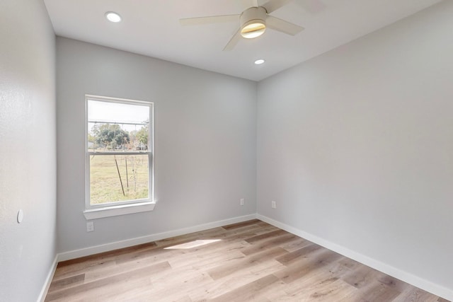 unfurnished room with light wood-type flooring and ceiling fan