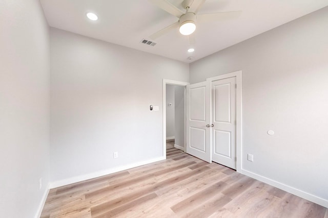 unfurnished bedroom with light hardwood / wood-style flooring and ceiling fan