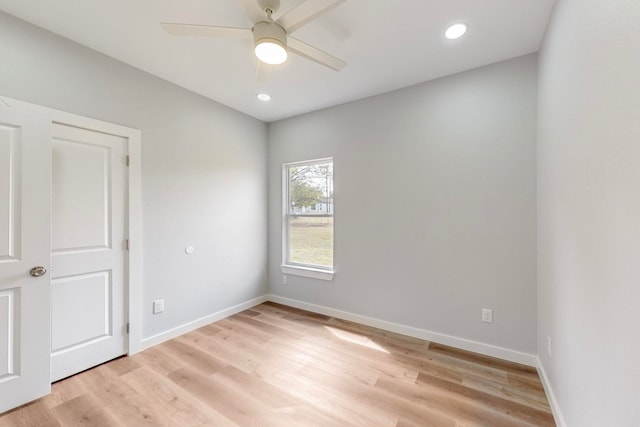 empty room featuring light hardwood / wood-style floors and ceiling fan